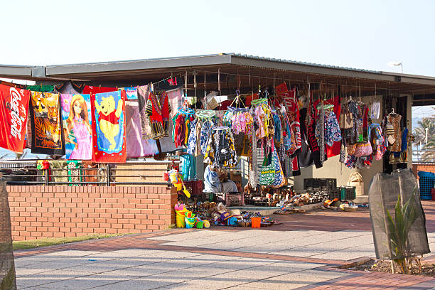 Zrenjanin, Serbia, July 04, 2020. Local flea market and sale of everything and everything. The salesman advertises his goods with a wide smile.