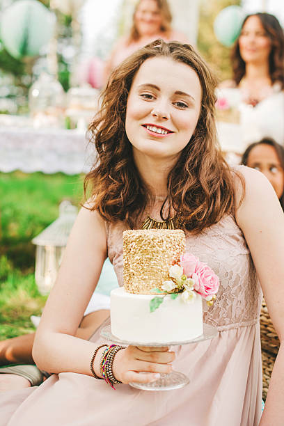 istock Pretty young woman with a beautiful cake 500921257