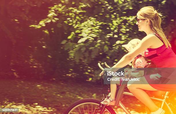 Riding The Bicycle With Daughter Stock Photo - Download Image Now - 2-3 Years, Activity, Adult