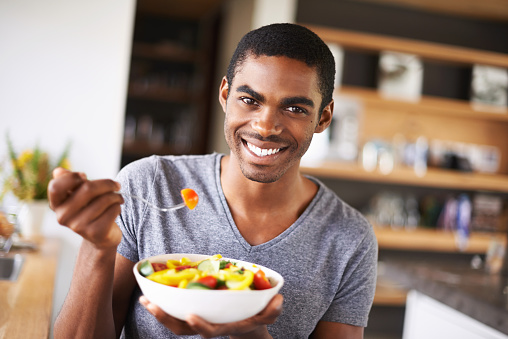 Indoor shot of a gorgeous young black man showing off his fruit saladhttp://195.154.178.81/DATA/i_collage/pi/shoots/783494.jpg