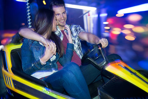 istock couple in a bumper car 500923523