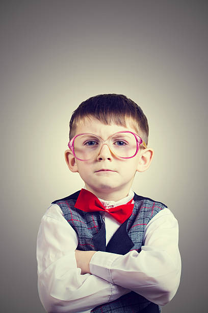 istock Confident little boy nerd isolated over yellow background. 500924214