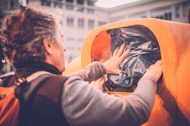 istock Man Collecting Trash in Nature 500924842