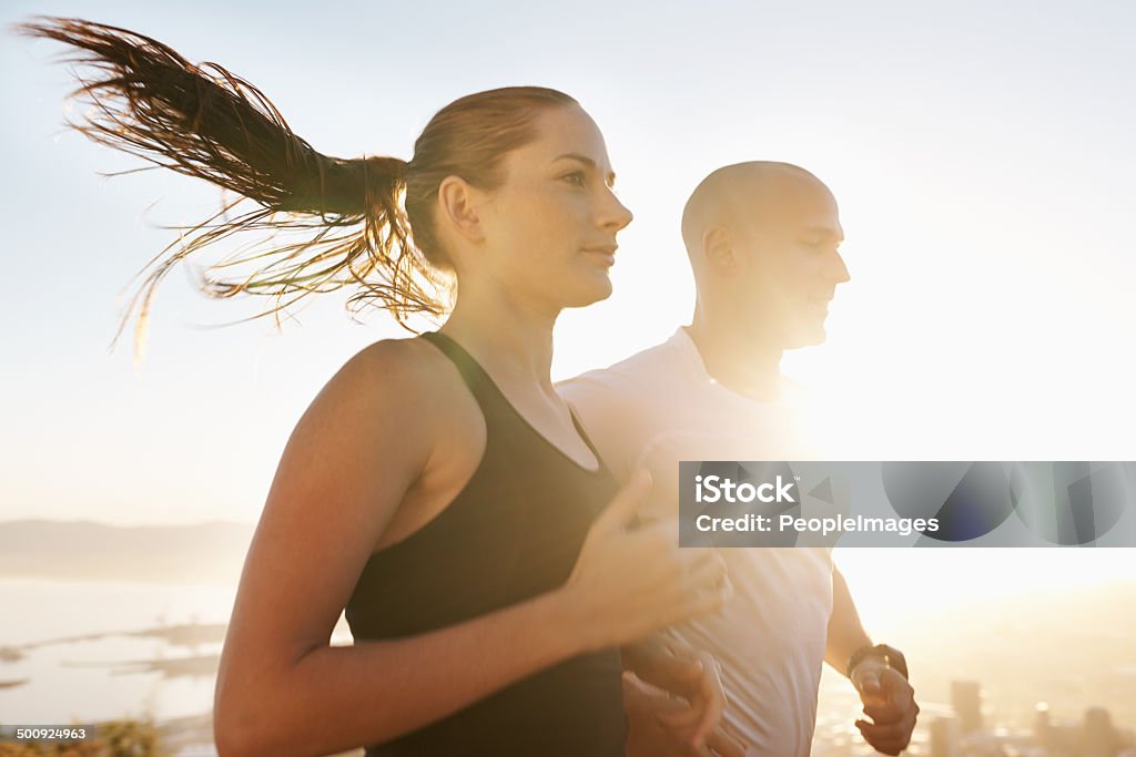 Having a partner makes the run much easier Cropped shot of a two young athletes running outdoorshttp://195.154.178.81/DATA/i_collage/pi/shoots/783460.jpg Couple - Relationship Stock Photo