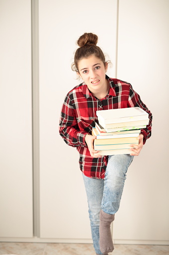 Teen charged books to study with tired face