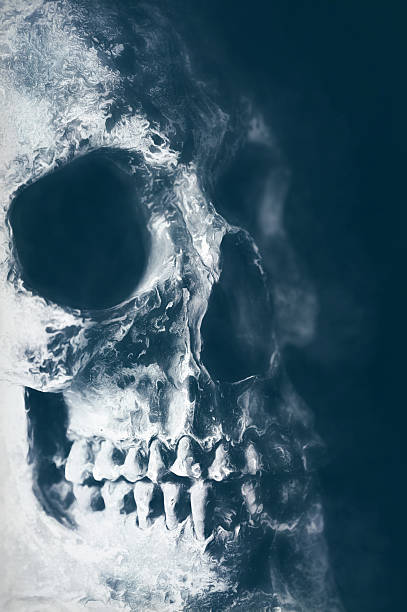 istock Digital art, paint effect, cracked and damaged human skull 500926002