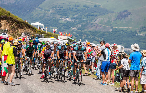 The Peloton in Pyrenees Mountains  Col de Val Louron-Azet, France- July 07,2013: The peloton passing the Col de Val Lauron-Azet in Pyrenees Mountains during the stage 9 of the 100 edition of Le Tour de France in 2013. tour de france stock pictures, royalty-free photos & images