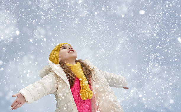 istock girl plaing on winter walk 500926616