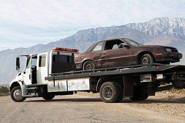 istock Broken car on tow truck 500927247