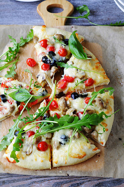 istock cheese pizza with mushrooms and cherry tomatoes 500928054
