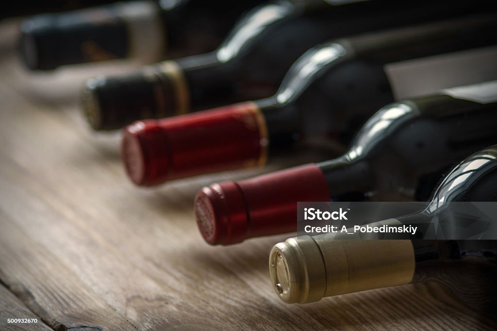 Row of wine bottles. Row of wine bottles. Low depth of field. Wine Bottle Stock Photo