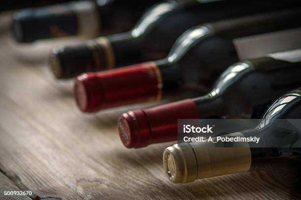 Row Of Wine Bottles Stock Photo - Download Image Now - Wine Bottle, Close-up, Alcohol - Drink