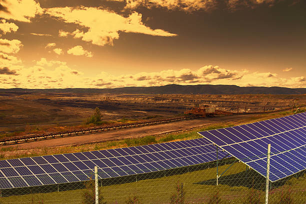istock Coal mine with solar energy panels at sunset 500935410
