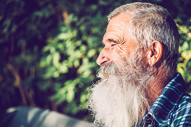 istock Senior Man with Enjoying with Eyes Closed in his Backyard 500937194