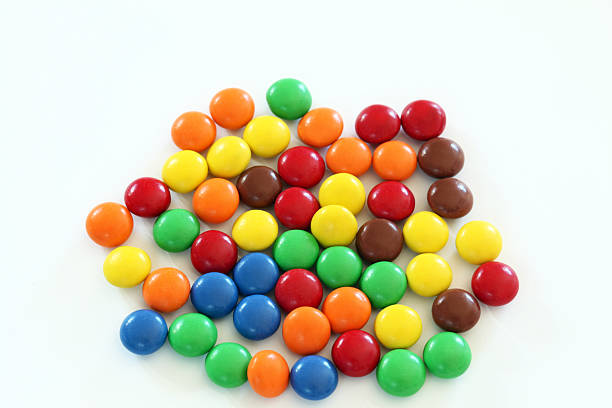 Several pieces chocolate candy. White background.  Many colors. stock photo