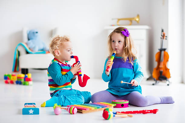 istock Boy and girl playing flute 500938756
