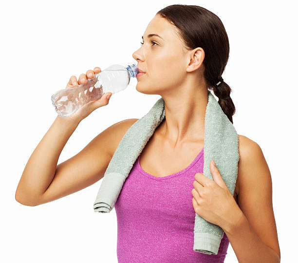 istock Fit Woman Drinking Water From Bottle 500942763