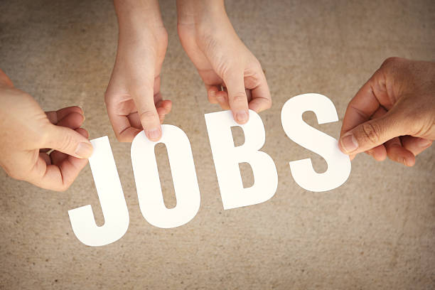 istock Jobs - Hands Holding White Letters Over Grunge Background 500943967
