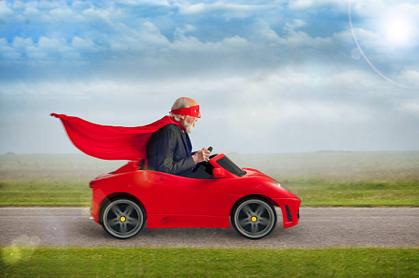 senior supereroe guida un giocattolo auto sportiva - cape merry foto e immagini stock