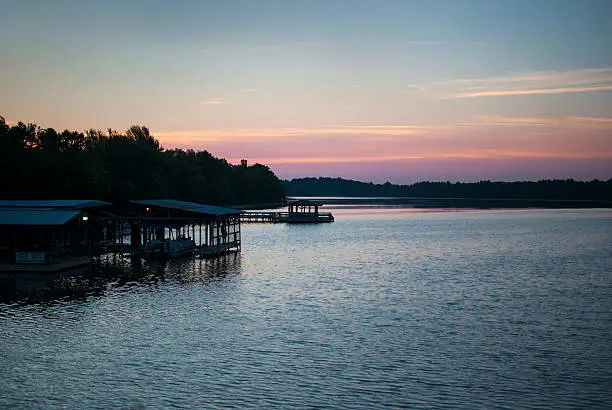 A small marina silhouetted by the dawn light at Lake Fayetteville, Arkansas