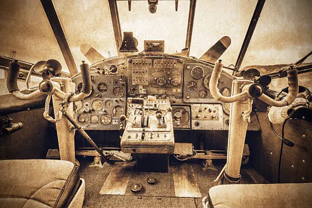 Cockpit view of the old retro plane. Vintage style image.