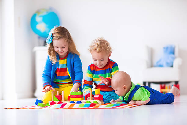 istock Kids playing with wooden toy train 500955782