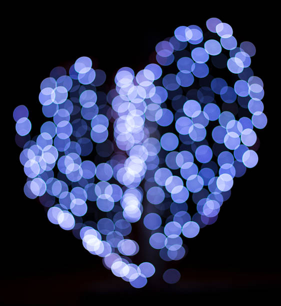 istock light shape heart. blue heart on black background. 500957272
