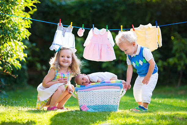 istock Kids playing with newborn baby brother 500958358