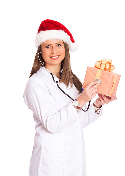 istock happy doctor woman with gift isolated on white 500959702