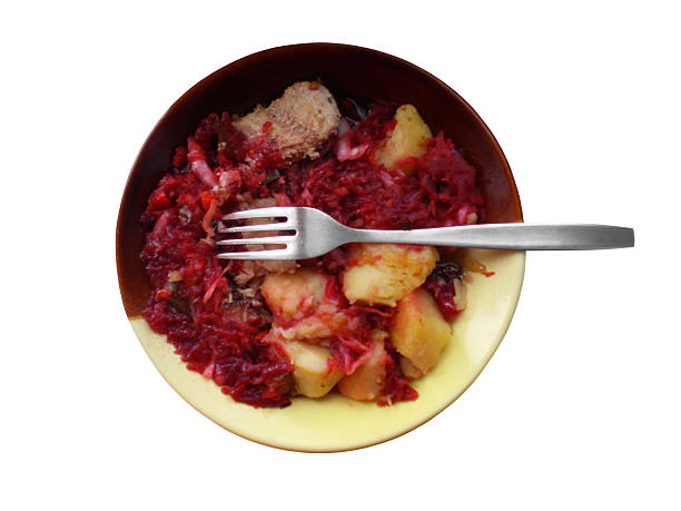Fried potatoes with beet salad with chunks of sardines
