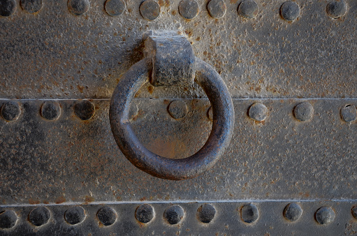 Detail of old metal door handle.