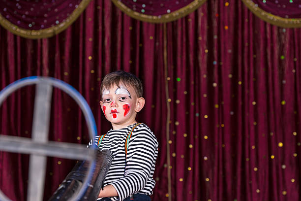 istock Young Clown Holding Large Gun with Iron Sight 500963468