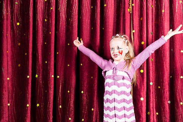 istock Pretty girl in pantomime costume on stage 500965212