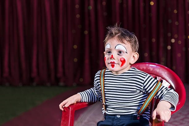 istock Kid with entertaining skills and clown make-up 500966836