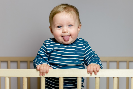 Baby playing in the crib