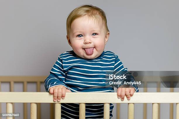 Baby In The Crib Stock Photo - Download Image Now - Baby - Human Age, Baby Boys, Babies Only