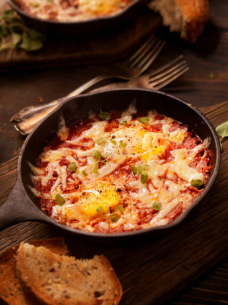istock Eggs Baked in Spice Tomato Sauce with Mozzarella Cheese 500967730