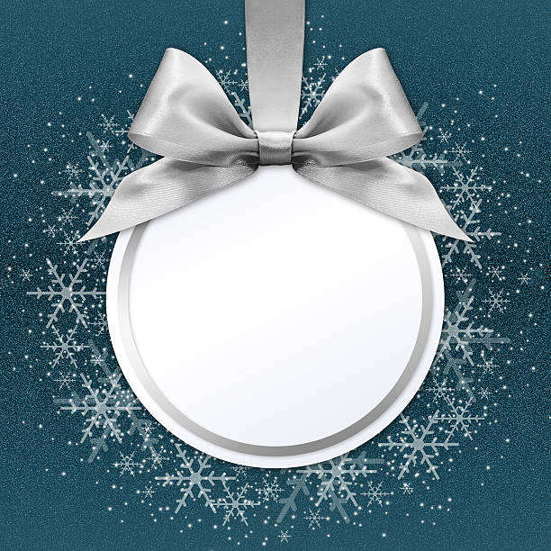 istock christmas ball with silver satin ribbon bow on blue background 500969234