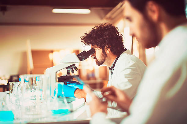 istock Young scientists in garage laboratory, research, technology 500989344