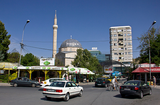 Bitola, Macedonia - September 5, 2015: People walk in the street near the ottoman Mosque in Bitola, Macedonia. From 1382 to 1912, Manastır (now Bitola) was part of the Ottoman Empire.