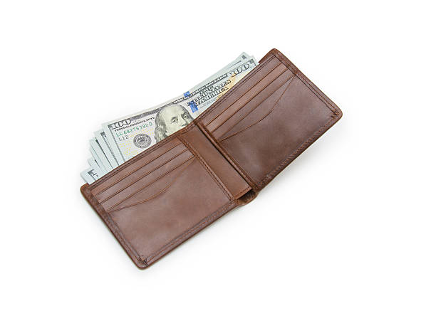 istock purse with money isolated on white 500990094