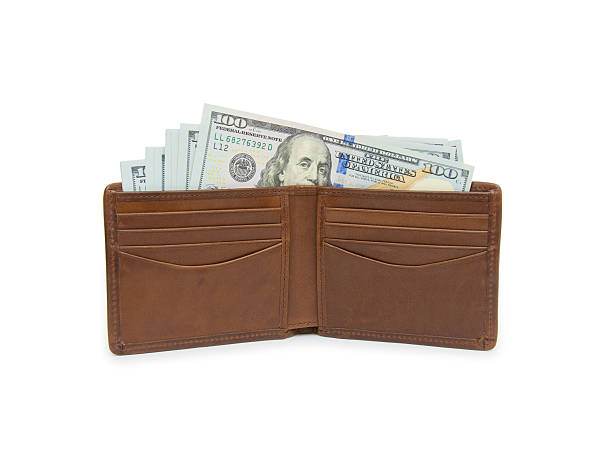 istock purse with money isolated on white 500990124