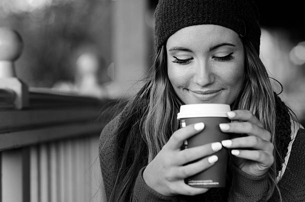 Beautiful coffee drinker portrait in black and white stock photo