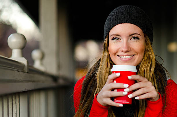 istock Joyful young caucasian woman enjoying coffee 500991364