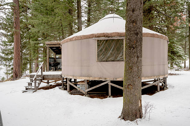 istock Snow covered Yurt in the forest winter 500992208