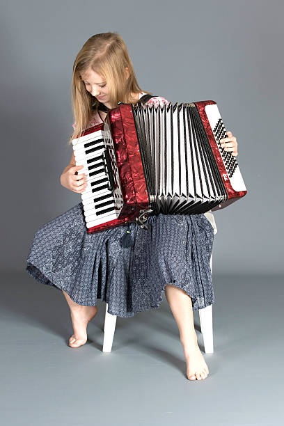 istock Girl playing tune on Accordion 500994508
