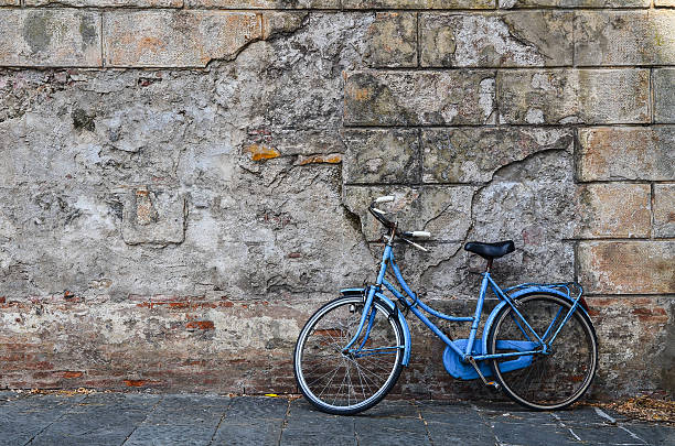 istock Blue vintage bicycle and vintage brick wall 500995020