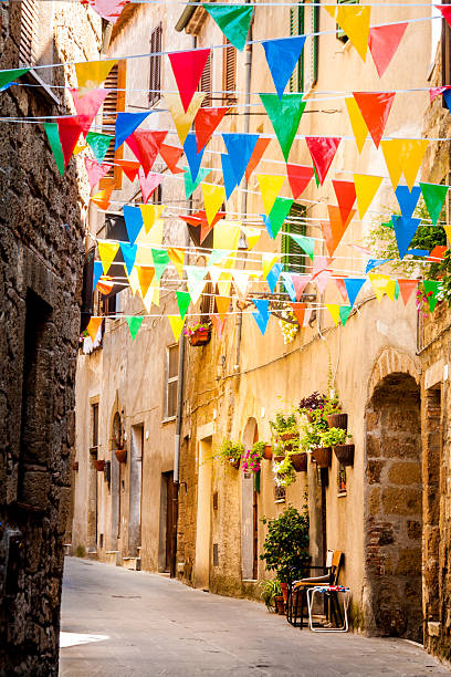 istock Colorful Party flags wave in a little alley 500995234