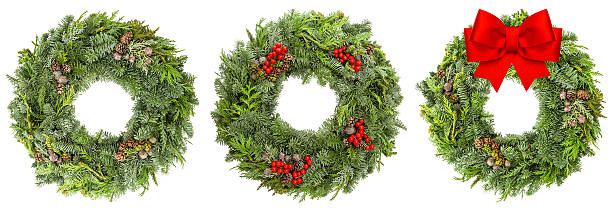 istock Christmas wreath with cones red berries ribbon bow 500996392