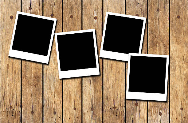 istock Old picture frame on wood background 500996520